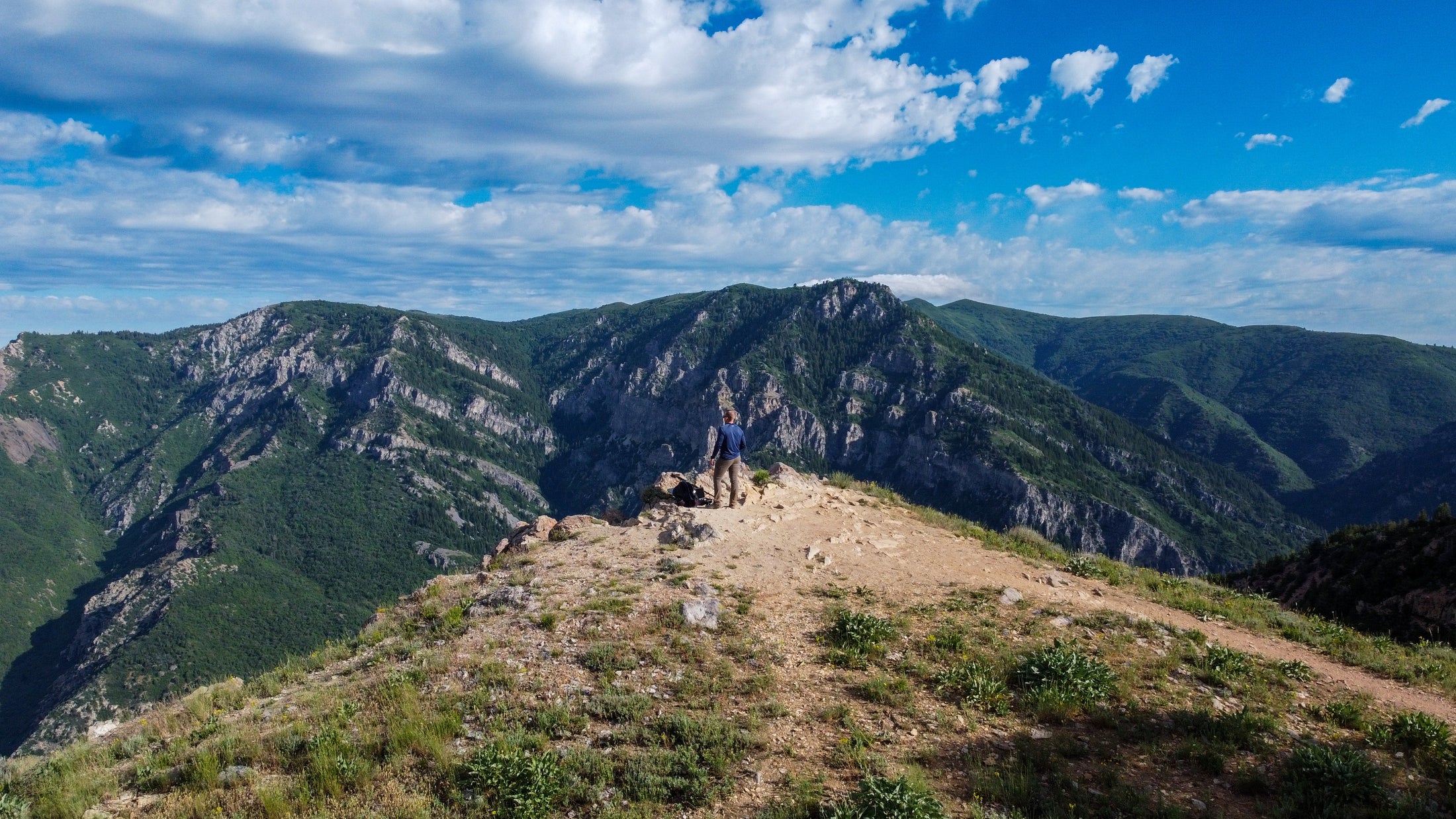 High mountain trail overlooking the ridges and basin at Snowbasin near Huntsville, Utah
